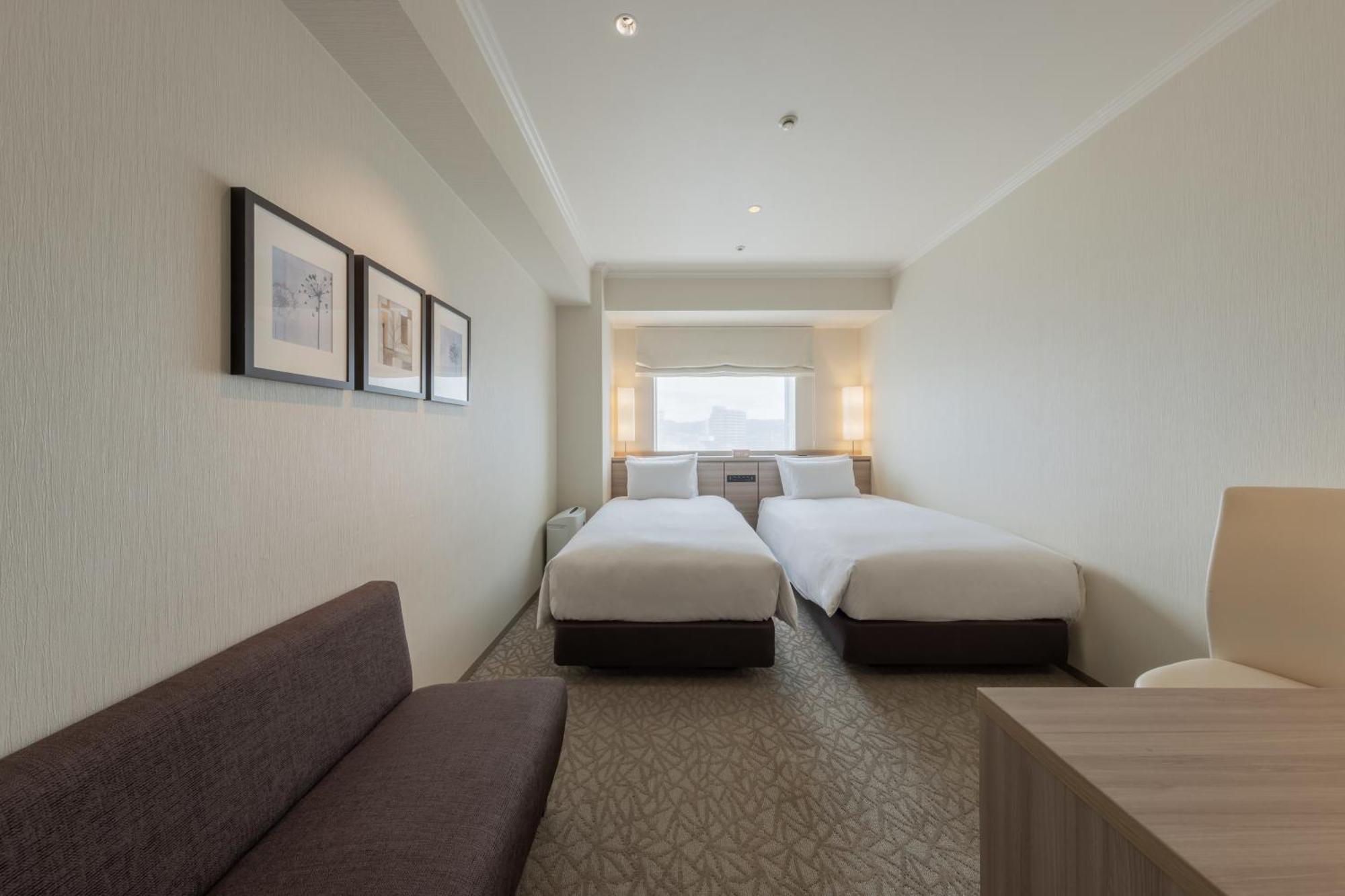 Hotel Associa Toyohashi Buitenkant foto A room at the hotel